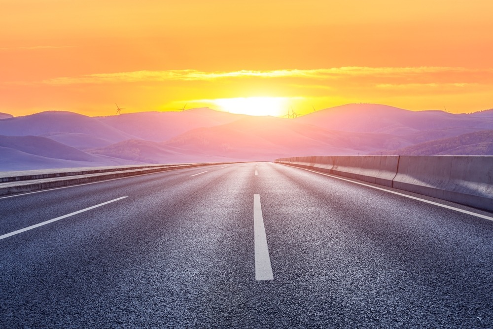 Asphalt,Road,And,Mountain,With,Beautiful,Sky,Clouds,At,Sunrise