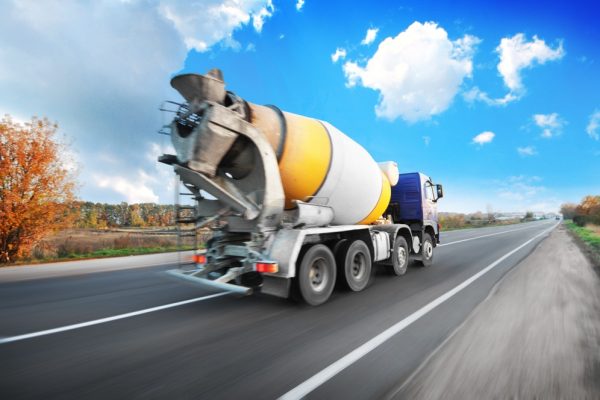 Blue,Concrete,Mixer,Truck,Driving,Fast,On,The,Countryside,Road